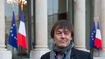 Nicolas Hulot sort de l'Elysée, le 6 décembre 2012, après une rencontre avec le président de la République François Hollande. (BERTRAND LANGLOIS / AFP)