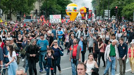 Des opposants à la loi Travail défilent à Paris, mardi 5 juillet 2016. (SERGE TENANI / CITIZENSIDE / AFP)