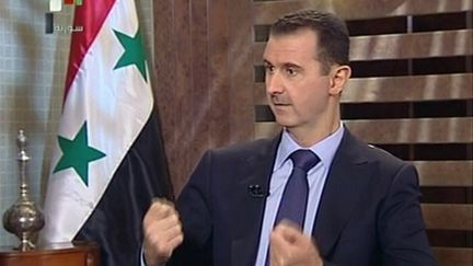 Le pr&eacute;sident syrien Bachar al-Assad dans une interview &agrave; la t&eacute;l&eacute;vision d'Etat, le 21 ao&ucirc;t 2011. (AFP)