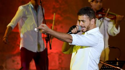 Le chanteur marocain Saad Lamjarred lors d'un festival à Tunis, le 30 juillet 2016 (FETHI BELAID / AFP)