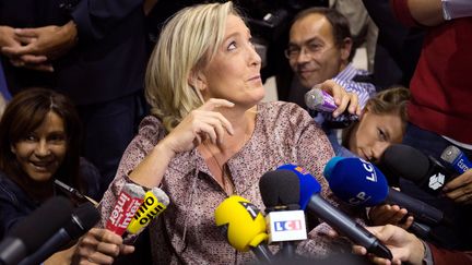 La pr&eacute;sidente du Front national, Marine Le Pen, lors des universit&eacute;s du FN, &agrave; Marseille (Bouches-du-Rh&ocirc;ne), le 14 septembre 2013. (BERTRAND LANGLOIS / AFP)