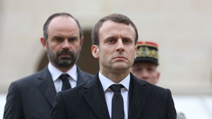 Le président Emmanuel Macron et le Premier ministre Edouard Philippe lors d'une cérémonie d'hommage à Arnaud Beltrame, le 28 mars 2018. (LUDOVIC MARIN / AFP)