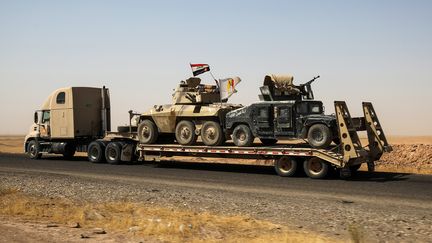 Des véhicules paramilitaires quittent la ville de Tal Afar après la proclamation de victoire du Premier ministre irakien, le 31 août 2017. (AHMAD AL-RUBAYE / AFP)