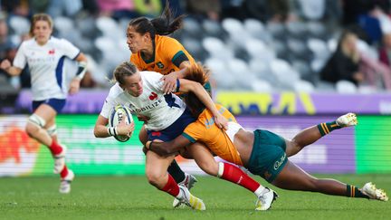 La joueuse du XV de France féminin Marine Menager, plaquée contre l'Australie lors du WXV, le 28 octobre 2023 (DEREK MORRISON / AFP)