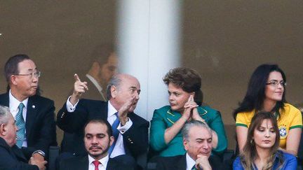 En proie à une relative contestation, Dilma Rousseff, la présente brésilienne, a joué la discrétion lors de la cérémonie d'ouverture de la Coupe du monde de football à Sao Paulo, le 12 juillet 2014. (WILLIAM VOLCOV / BRAZIL PHOTO PRESS)