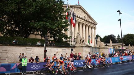 Female triathletes on the Olympic cycling course, July 31, 2024. (ANNE-CHRISTINE POUJOULAT / AFP)