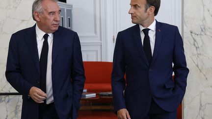 François Bayrou and Emmanuel Macron, June 21, 2022, in Paris.  (LUDOVIC MARIN / POOL)