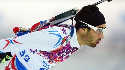 L'athl&egrave;te Martin Fourcade en comp&eacute;tition au Biathlon des Jeux olympique d'hiver de Sotchi 2014 ( AFP )