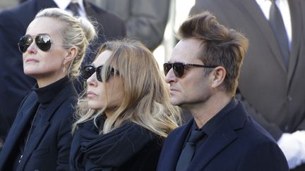 Laeticia Hallyday , Laura Smet et David Hallyday lors des obsèques de Johnny
 (Bernard MANIGAULT / AFP)