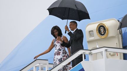 &nbsp; (Michelle et Barack Obama, à leur arrivée à Cuba © Reuters/Carlos Barria)