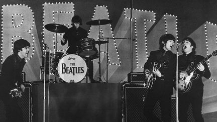 Les Beatles sur scène au Japon en 1966
 (JIJI PRESS / AFP)