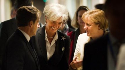 Nicolas Sarkozy, Christine Lagarde et Angela Merkel à Bruxelles le 21 juillet 2011 (AFP - POOL - BUNDESREGIERUNG - STEFFEN KUGLER)