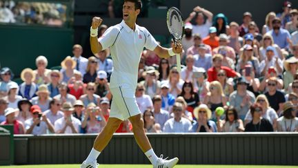  Novak Djokovic heureux sur le gazon londonien (GLYN KIRK / AFP)