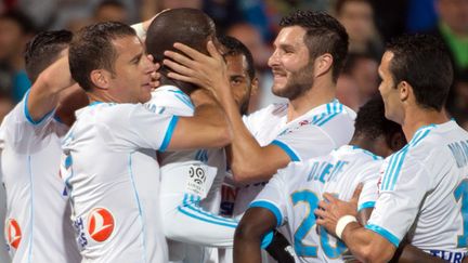 La joie des joueurs de l'OM (Cheyrou, Diawara, Gignac, Morel) (BERTRAND LANGLOIS / AFP)