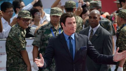 John Travolta, invité au lancement de la cité du cinéma de Qingdao (22 septembre 2013)
