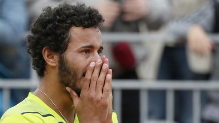 Laurent Lokoli sort grandi de son premier tournoi du Grand Chelem (PATRICK KOVARIK / AFP)