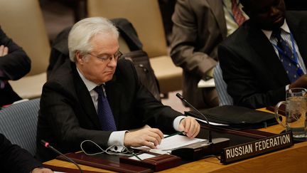 Vitali Tchourkine, l'ambassadeur de Russie &agrave; l'ONU, le 28 mars 2011, au Conseil de s&eacute;curit&eacute;, &agrave; New York (Etats-Unis). (CHRIS HONDROS / GETTY IMAGES NORTH AMERICA / AFP)