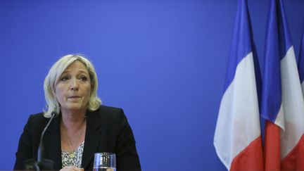 La pr&eacute;sidente du Front national lors d'une conf&eacute;rence de presse au si&egrave;ge du parti &agrave; Nanterre (Hauts-de-Seine), le 25 mars 2014. (SEBASTIEN MUYLAERT / CITIZENSIDE / AFP)