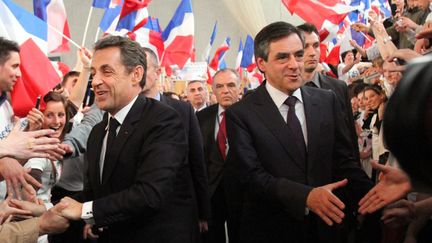 Nicolas Sarkozy et Fran&ccedil;ois Fillon arrivent &agrave; une r&eacute;union publique de l'UMP en vue de l'&eacute;lection pr&eacute;sidentielle de 2012, le 24 avril 2012 &agrave; Cernay (Haut-Rhin).&nbsp; (MAXPPP)