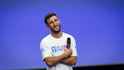 Sofiane Oumiha lors d'une conférence de presse au Club France à la Grande Halle de la Villette à Paris, le 24 juillet 2024. (VALROFF LAURENE / KMSP)