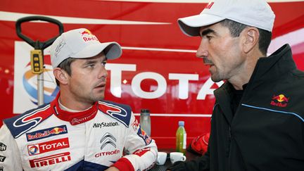 Sébastien Loeb discute avec Luc Alphand avant le rallye d'Alsace 2010