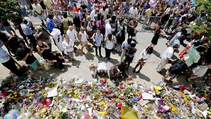 &nbsp; (La tuerie a provoqué une onde de choc bien au-delà de la ville de Charleston © Paul Zoeller/Reuters)