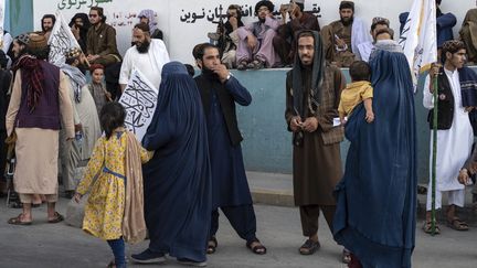 Women in burqas walk the streets of Kabul on August 14, 2024 in Afghanistan. (WAKIL KOHSAR / AFP)