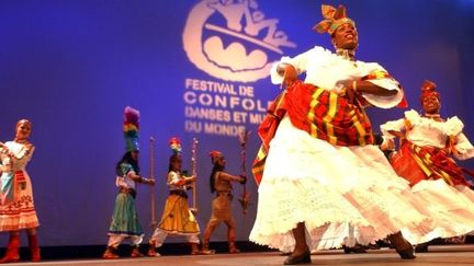 ©PHOTOPQR/LA NOUVELLE REPUBLIQUE/DOMINIQUE BORDIER ; CONFOLENS (CHARENTE) LE 12/08/2004 ; AUTOPROCLAMEE CAPITALE MONDIALE DU FOLKLORE, CONFOLENS ACCUEILLE DU 7 AU 15 AOUT SON 47EME FESTIVAL INTERNATIONAL DE FOLKLORE. QUINZE GROUPES FOLKLORIQUES VENUS DES QUATRE COINS DU MONDE SE SUCCEDENT SUR LA SCENE EN PLEIN AIR EN BORDURE DE LA CHARENTE POUR CE FESTIVAL QUI REUNIT CHAQUE ANNEE UNE MOYENNE DE 35000 SPECTATEURS. PHOTO: LA SOIREE INAUGURALE 47th International Folklore Festival in Confolens (France) from 7 to August 15.
 (©PHOTOPQR/LA NOUVELLE REPUBLIQUE/DOMINIQUE BORDIER)