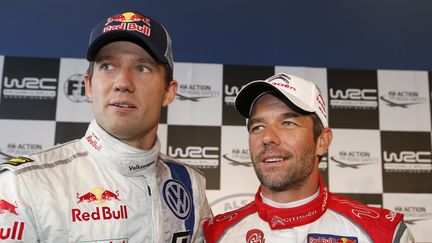 Le Fran&ccedil;ais S&eacute;bastien Ogier (G) et son compatriote S&eacute;batien Loeb (D), le 3 octobre 2013 lors du Rallye de France, &agrave; Strasbourg (Bas-Rhin). (FRANCOIS BAUDIN / AUSTRAL / AFP)