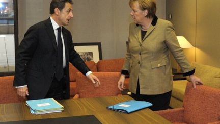 Nicolas Sarkozy et Angela Merkel à Bruxelles (30 janvier 2012) (PHILIPPE WOJAZER / POOL / AFP)