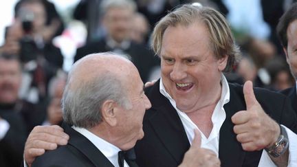 Après le très décevant "Welcome to New York", Depardieu est resté à Cannes pour présenter "United Passion", un film sur la Coupe du Monde de football dont il incarne le créateur Jules Rimet. Logique, qu'il arrive au Palais en compagnie de l'actuel président de la FIFA. 
 (Franck Castel/Wostok Press/Maxppp Frace)