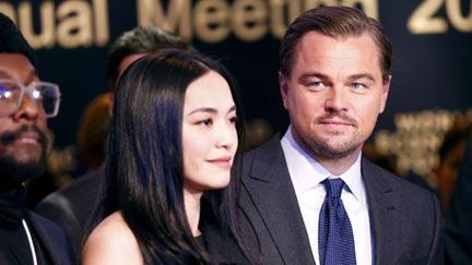 Le musicien américain Will.i.am, l'actrice chinoise Yao et Leonardo DiCaprio à Davos. (Ruben Sprich/reuters)