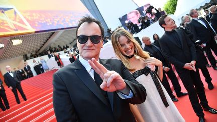 Quentin Tarantino et Margot Robbie présentent&nbsp;&nbsp;"Once Upon a Time... in Hollywood" dans la joie et la bonne humeur.&nbsp; (ALBERTO PIZZOLI / AFP)