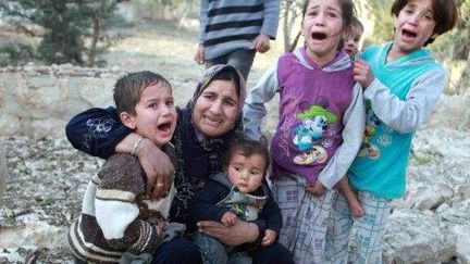 Après un bombardement d'un quartier d'Alep par l'avation de Bachar al-Assad, le 28 décembre 2013. (AFP/ Samet Dogan)