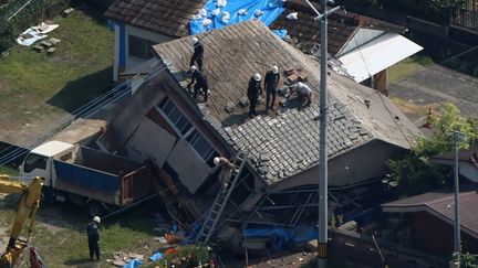 An aerial view shows a collapsed house in Osaki, Japan, after an earthquake on August 8, 2024. (KOTA KIRIYAMA / YOMIURI / AFP)