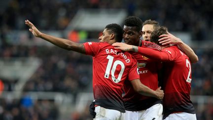 Manchester United a enchaîné une quatrième victoire de rang en s'imposant à Newcastle (LINDSEY PARNABY / AFP)