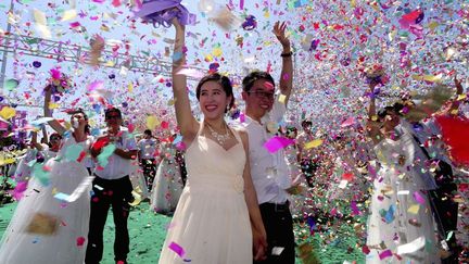 Mariages collectifs à Shenyang le 2 août 2014 à l'occasion du Qixi Festival ( fête de l'amour)  (Reuters/Stringer)