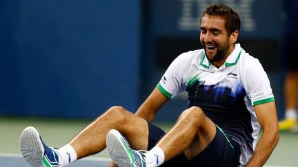 Marin Cilic s'écroule au sol après son succès à l'US Open 2014