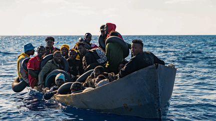 Migrants prepare to board the rescue vessel "Rise Above", on November 3, 2022, off Sicily (Italy).  (SEVERINE KPOTI / LIFELINE MISSION / AFP)