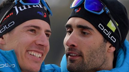 Quentin Fillon Maillet et Martin Fourcade lors du biathlon d'Antholz-Anterselva le 15 février 2020 (TIZIANA FABI / AFP)