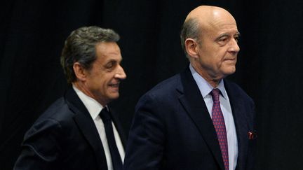 Nicolas Sarkozy et alain Juppé, le 14 octobre 2015 (NICOLAS TUCAT / AFP)