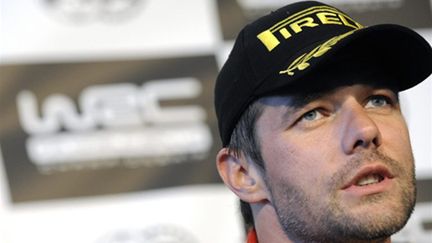 Sébastien Loeb en conférence de presse (JOHANNA LEGUERRE / AFP)