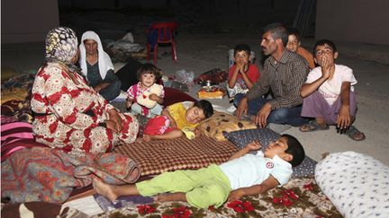 &nbsp; (Une famille de yézidis réfugiée © Reuters)