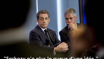 Nicolas Sarkozy et Laurent Wauquiez, à la première assemblée plénière du comité des maires de l'UMP, le 11 mars 2015, à Paris.&nbsp; (CHRISTOPHE MORIN / MAXPPP)