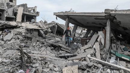 A man in the rubble on February 12, 2024, in the Gaza Strip.  (Jihad AlSharfi/Anadolu/AFP)