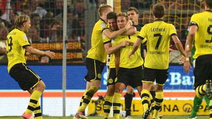 Les joueurs de Dortmund (PATRIK STOLLARZ / AFP)