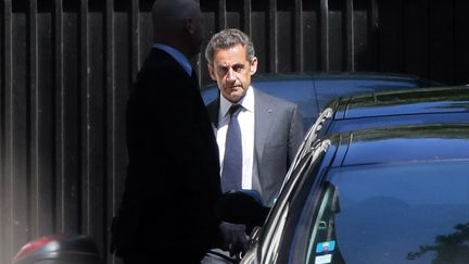 Nicolas Sarkozy quitte son domicile, &agrave; Paris, le 2 juillet 2014. (JACQUES DEMARTHON / AFP)