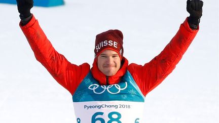 Avec quatre titres olympiques en poche, le Suisse Dario Cologna est entré un peu plus dans la légende. (ODD ANDERSEN / AFP)