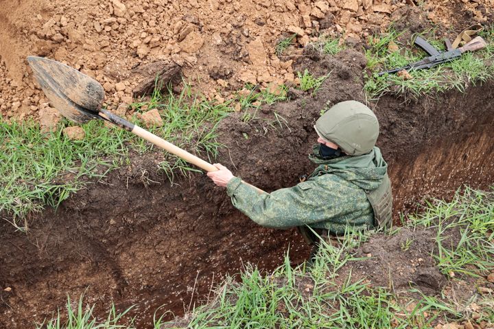 A Russian soldier digs a trench in the second defensive line in the occupied region of Zaporizhia (Ukraine), April 15, 2023. (VALENTIN SPRINCHAK / TASS / SIPA)