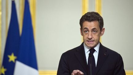 Nicolas Sarkozy le 19 mars 2011 à l'Elysée. Le président français annonce le lancement de l'intervention française en Libye, sous mandat onusien.    (LIONEL BONAVENTURE / POOL / AFP)